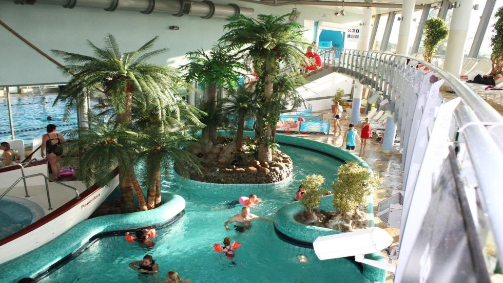 Thermal pool with underwater loungers, massage jets and current channel, © Oase Güstrow