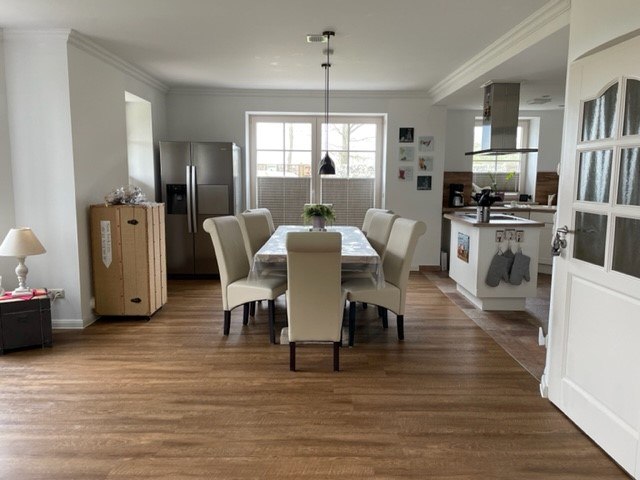 Spacious open kitchen with large dining table, © TMV