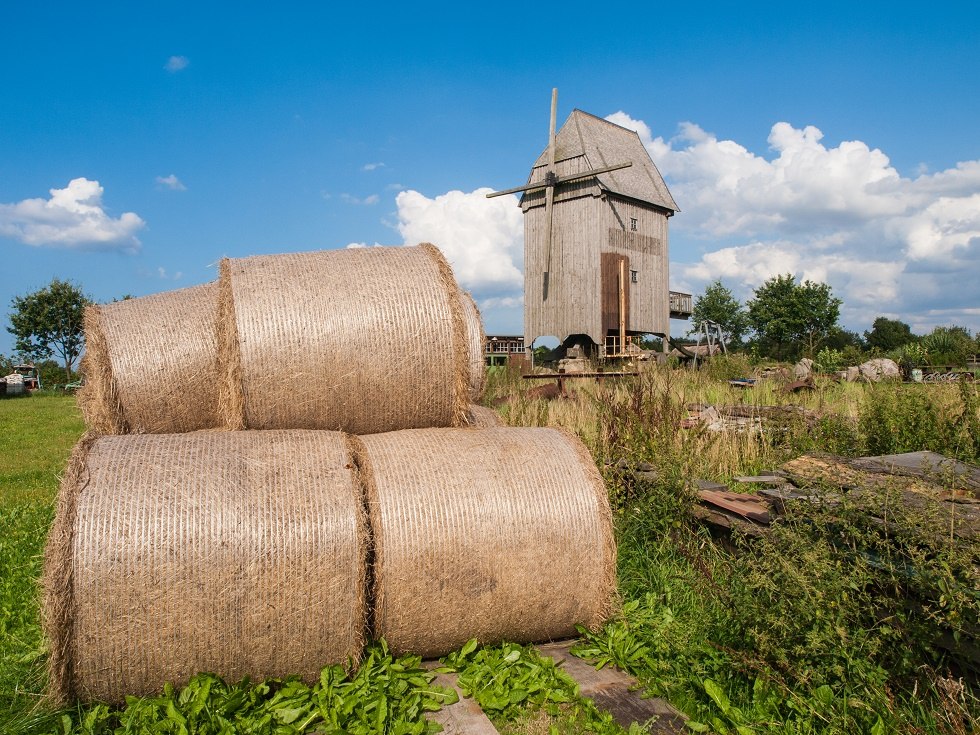 Windmill with straw rolls in the foreground., © Frank Burger