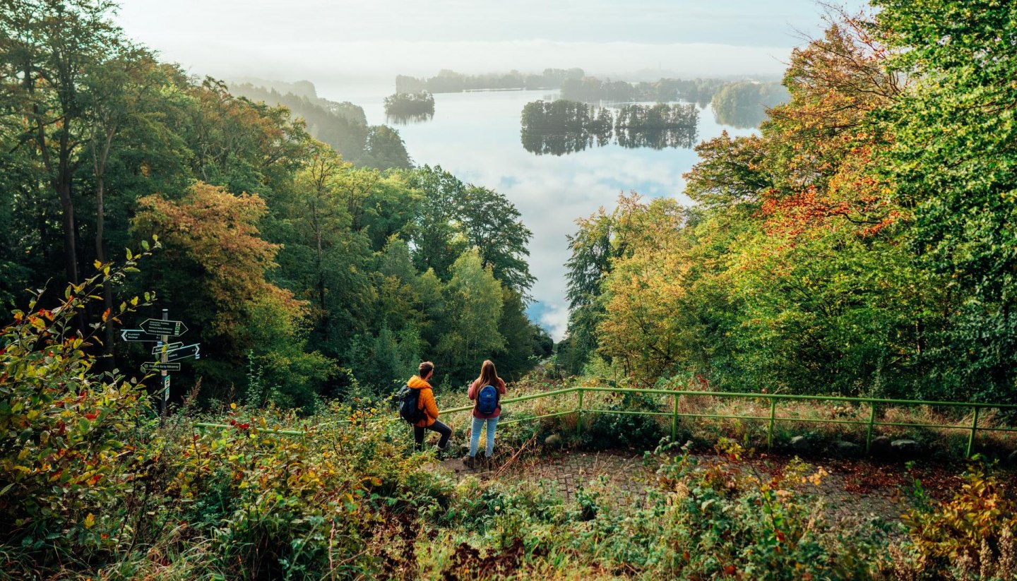 Hiking through the Feldberg lake district on the nature park trail with views of the landscape and lakes.