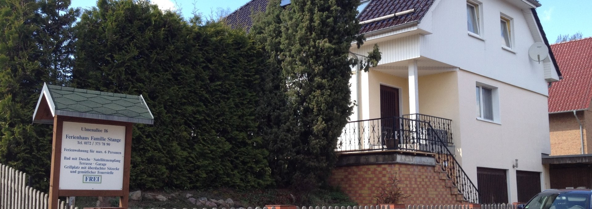 Terrace and garden protected from view by conifers, © S. Stange