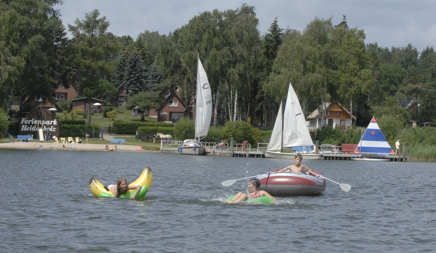 Bathing beach with sand in a bottle and fun on the water, © Timo Weisbrich