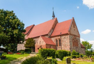 Church photographed sideways obliquely up the slope., © Frank Burger