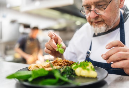 With a final touch, Frank Haarde places the wild herbs on the freshly caught plaice.