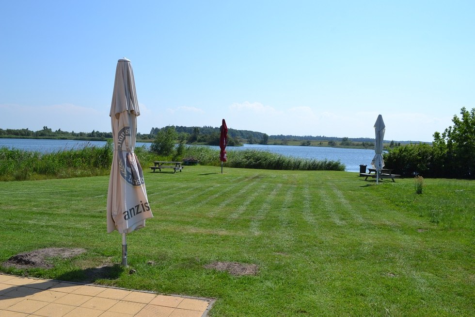 View to the lake over the manicured lawn, © Lutz Werner