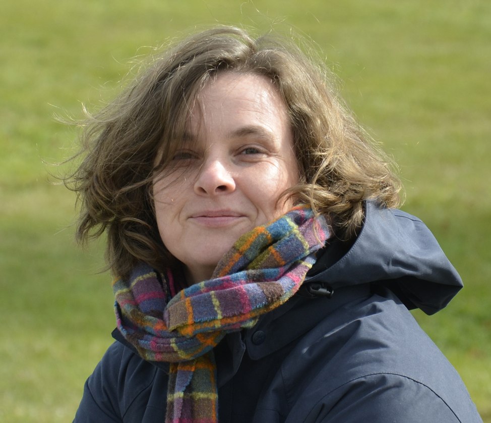 Portrait of Kristina Andres in front of a meadow with jacket and scarf, © Thomas Gallien