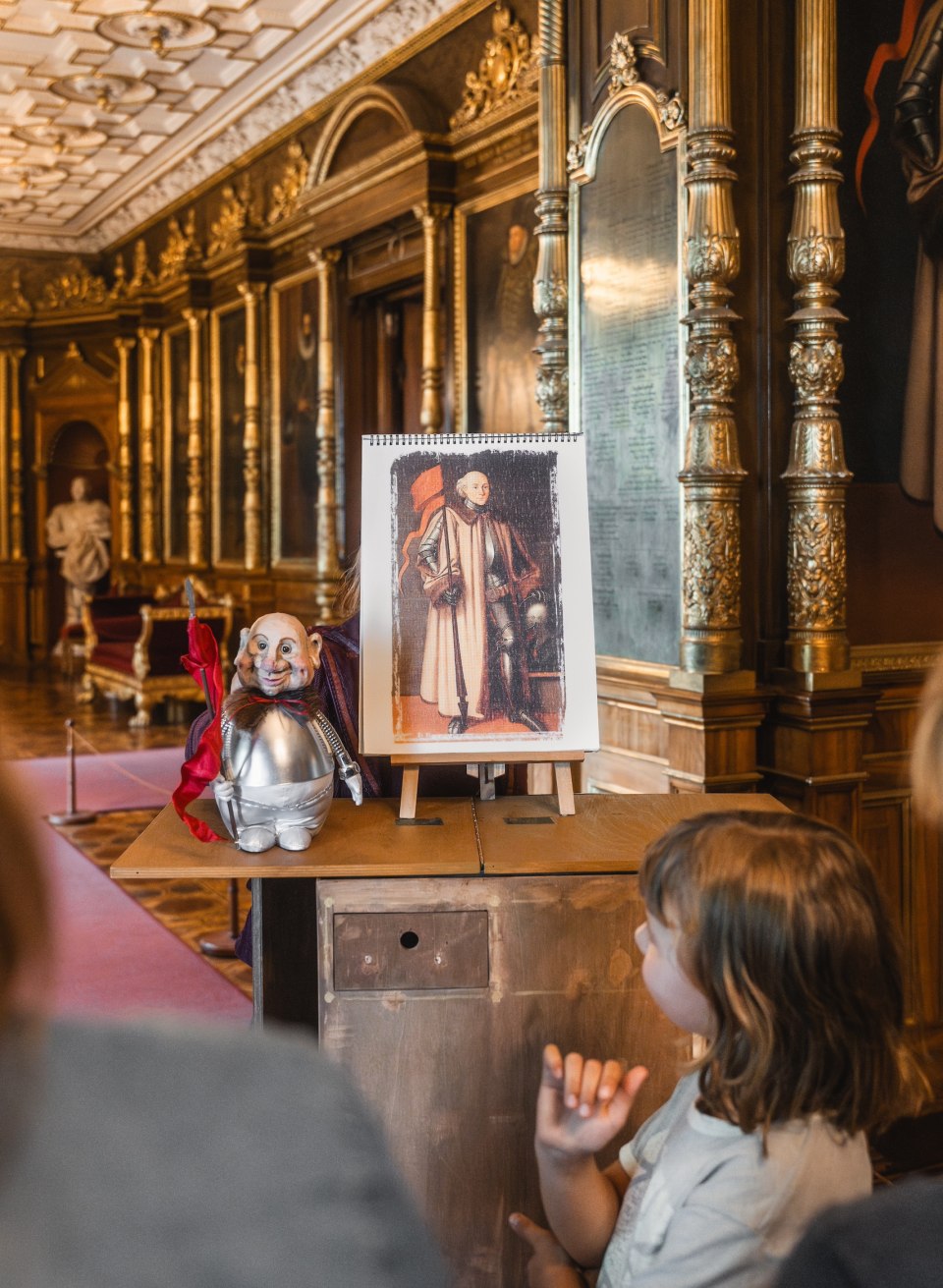 Enthusiastic children experience a magical tour of Schwerin Castle, accompanied by a fascinating puppet show