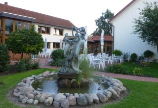 Restaurant and fountain, © Feriendorf an der Ostsee/Bley