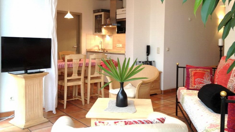 Living room and kitchen view of an apartment in the tower house, © Turmhaus Kühlungsborn