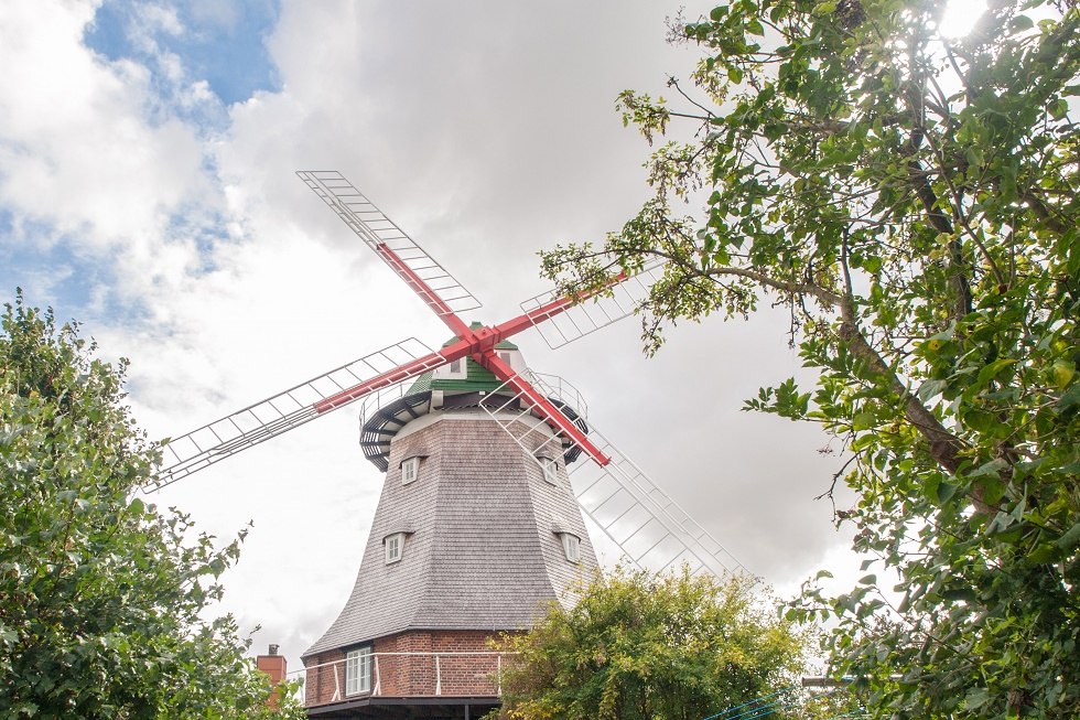 Mill framed by trees, © Frank Burger