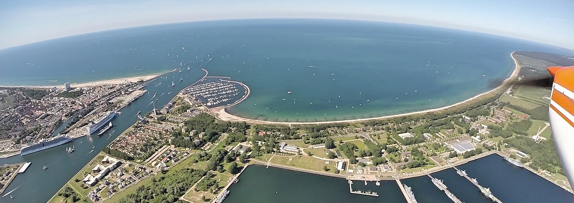 Bird's eye view of the harbor entrance and beach of Rostock-Warnemünde during the Hanse Sail, © ostseeflug.com