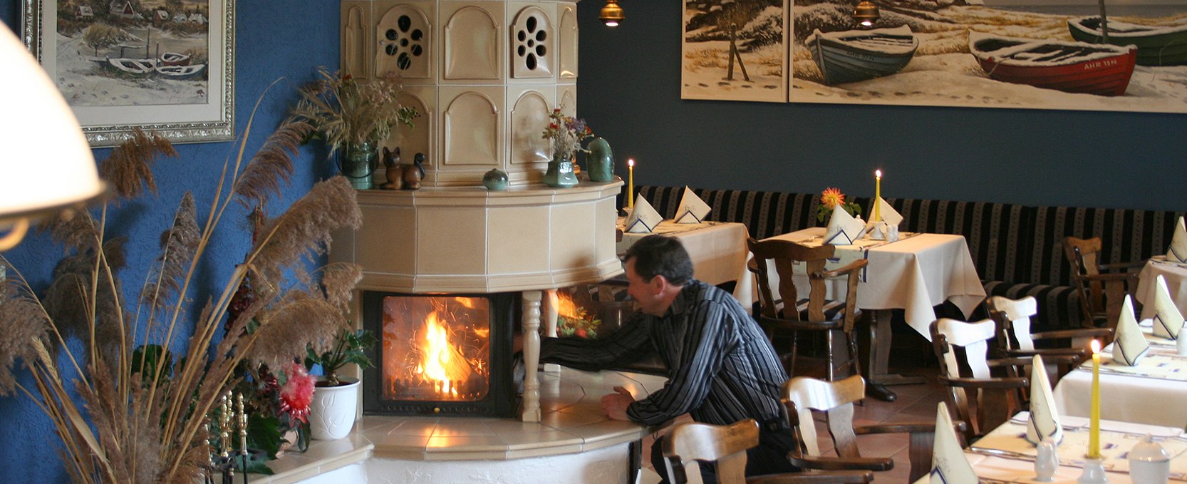 Cozy hours by the fireplace enchant at the end of a cold winter day, © Robert Niche