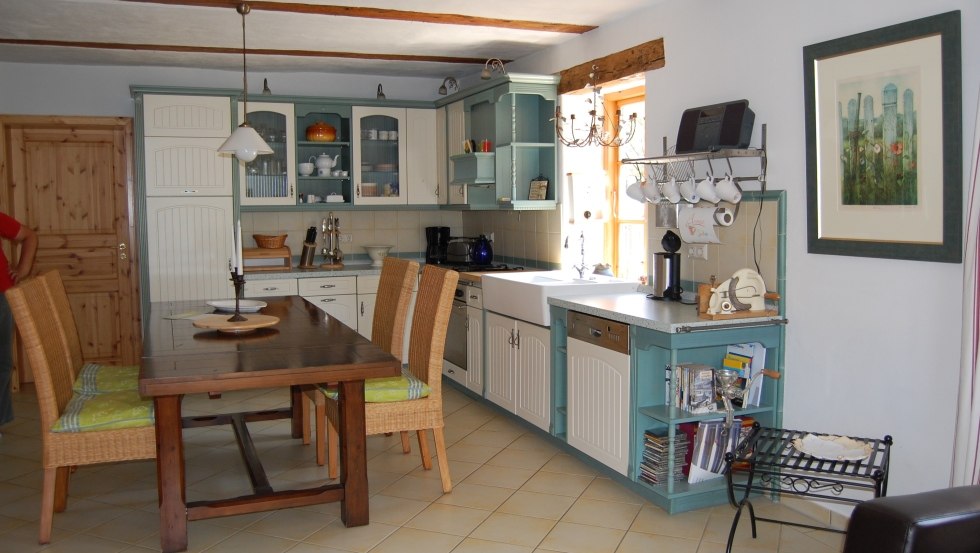 Comfortable well-equipped kitchen-living room with electric stove and fireplace, © S. Hoffmeister