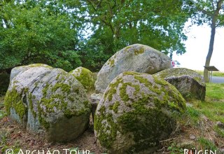 View of some stones of the large stone grave "Goldbusch" with information board, © Archäo Tour Rügen