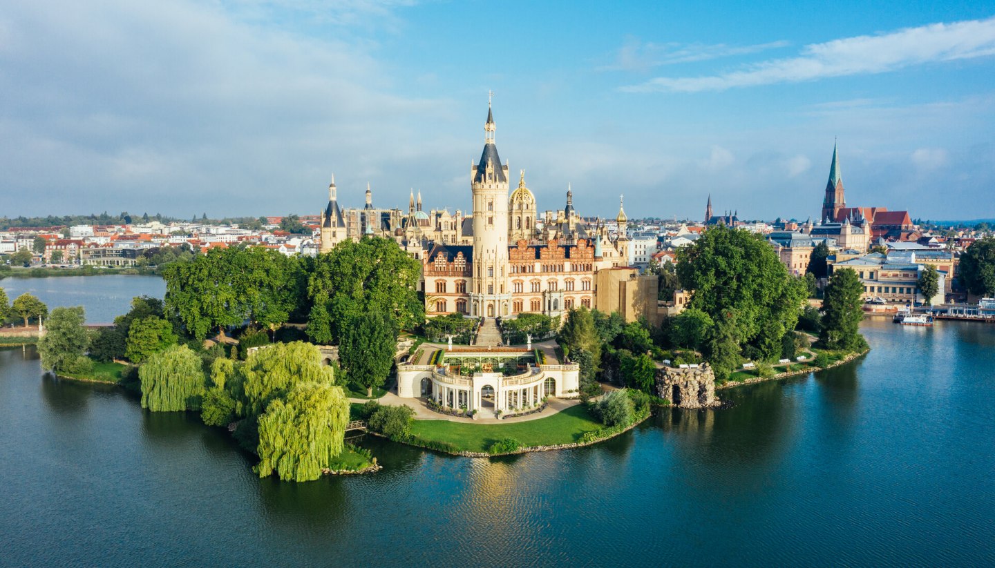 Schwerin Castle - its splendor still shines beyond the green expanses of its worth seeing parks, © TMV/Allrich