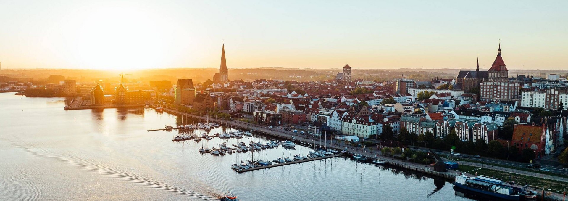 Sunrise in Rostock's city harbor, © TMV/Gänsicke