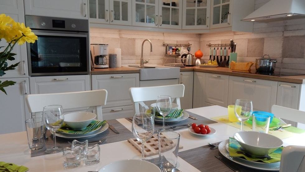 Family time in the modern kitchen with adjoining dining area, © @cramer