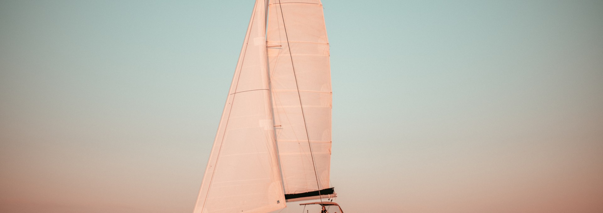 Sailing to the sunset off the coast of Warnemünde, © Outdoornomaden