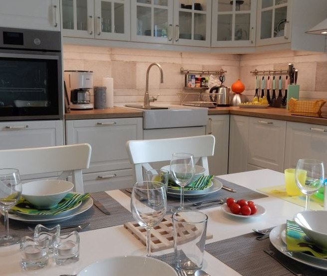 Family time in the modern kitchen with adjoining dining area, © @cramer