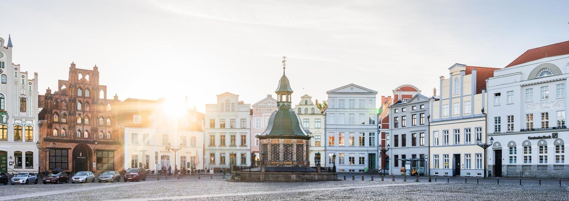 Market square with water art in the Hanseatic City of Wismar at sunrise, © TMV/Gross